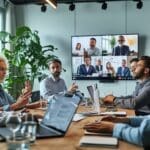 Latino employees in office conference room