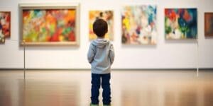 Unrecognizable child looking at modern art painting in a gallery