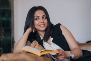 Cheerful Latina , reading book