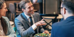 Smiling group of diverse businesspeople working together around a meeting table